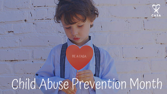 Boy Holding Child Abuse Prevention Month Heart